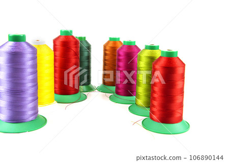 Colorful sewing thread, background, tailor-related images. On a white background. Isolated. 106890144