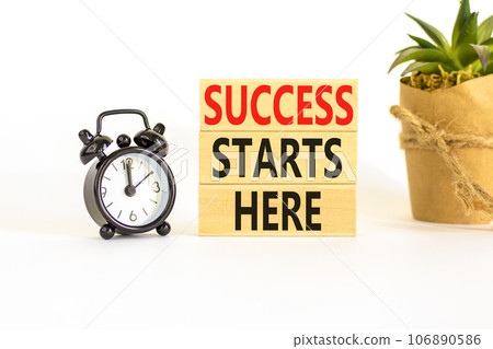Success starts here symbol. Concept word Success starts here on beautiful wooden block. Black alarm clock. Beautiful white background. Business motivational success starts here concept. Copy space. Success starts here symbol. Concept word Success starts here on beautiful wooden block. Black alarm clock. Beautiful white background. Business motivational success starts here concept. Copy space. 106890586