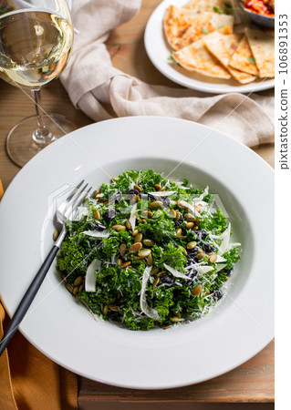 Fall kale salad with fennel and pumpkin seeds Fall kale salad with fennel and pumpkin seeds 106891353