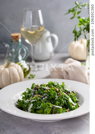 Fall kale salad with fennel and pumpkin seeds Fall kale salad with fennel and pumpkin seeds 106891360