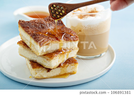 Cinnamon honey cheesecake pie cit into squares Cinnamon honey cheesecake pie cit into squares 106891381