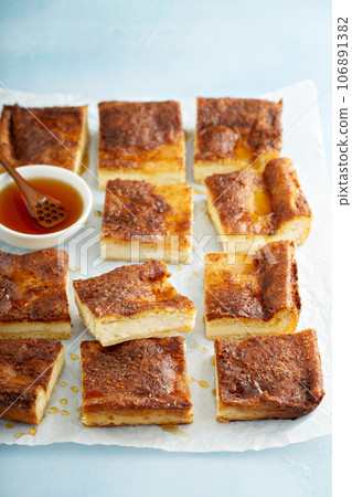 Cinnamon honey cheesecake pie cit into squares Cinnamon honey cheesecake pie cit into squares 106891382