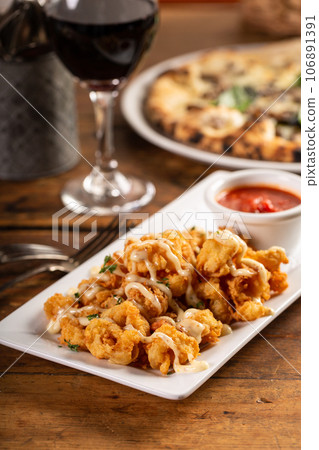 Popcorn shrimp appetizer with marinara sauce Popcorn shrimp appetizer with marinara sauce 106891391
