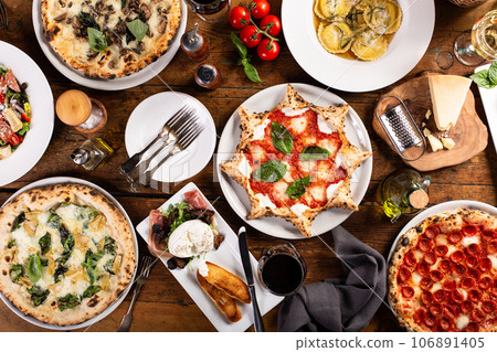 Variety of italian food on the table, pizza, pasta and appetizers 106891405