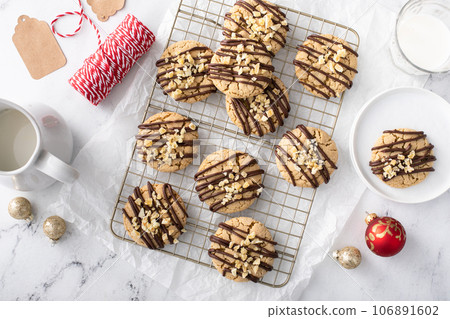 Candied ginger cookies drizzled with chocolate glaze 106891602