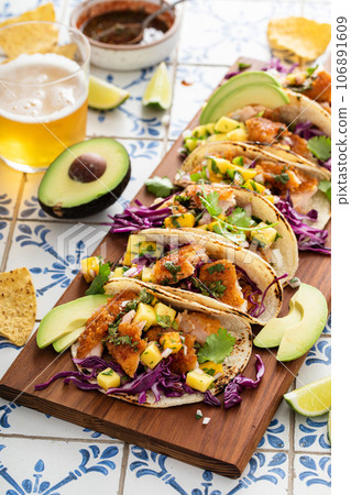 Fish tacos with mango salsa and red cabbage 106891609