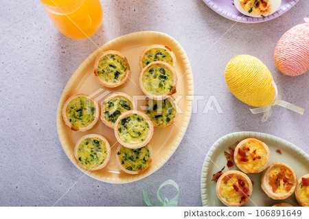 Mini quiches with spinach for Easter brunch 106891649