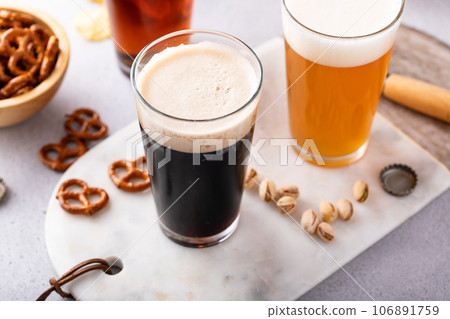 Variety of beer with snacks on the table 106891759