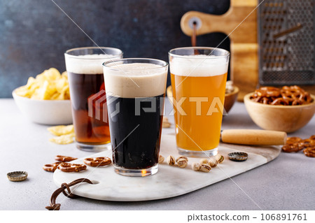 Variety of beer with snacks on the table 106891761