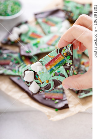 St Patricks day chocolate bark with sprinkles and rainbows St Patricks day chocolate bark with sprinkles and rainbows 106891803