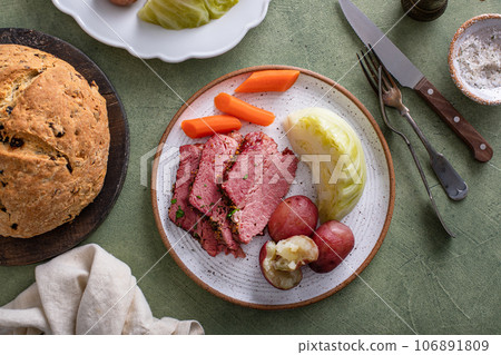 Corned beef with cabbage and potatoes dinner with soda bread 106891809
