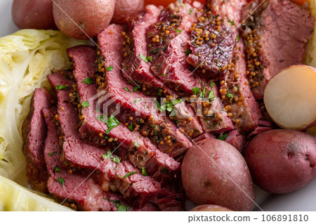 Corned beef with cabbage and potatoes on a serving platter 106891810