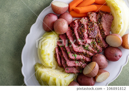 Corned beef with cabbage and potatoes on a serving platter 106891812