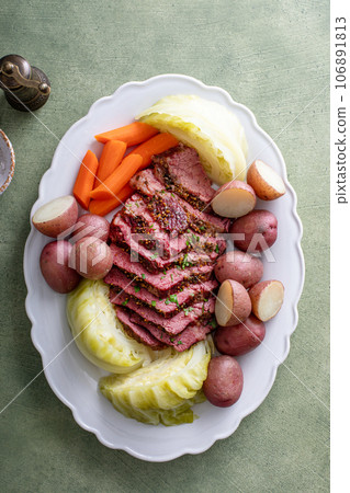 Corned beef with cabbage and potatoes on a serving platter 106891813