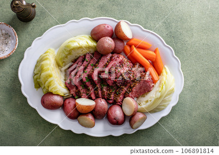 Corned beef with cabbage and potatoes on a serving platter 106891814