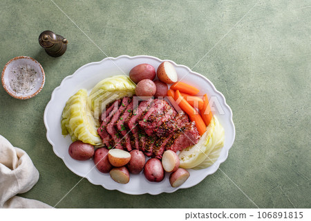 Corned beef with cabbage and potatoes on a serving platter 106891815