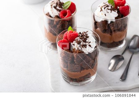 Chocolate trifle or parfait with chocolate mousse and whipped cream 106891844