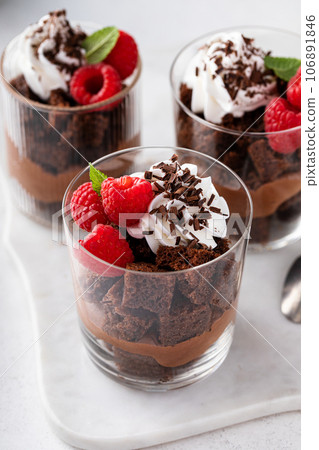 Chocolate trifle or parfait with chocolate mousse and whipped cream Chocolate trifle or parfait with chocolate mousse and whipped cream 106891846