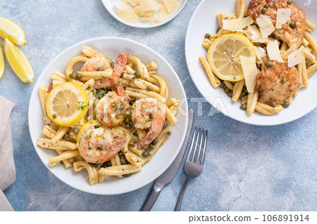 Chicken and shrimp piccatta with penne pasta Chicken and shrimp piccatta with penne pasta 106891914