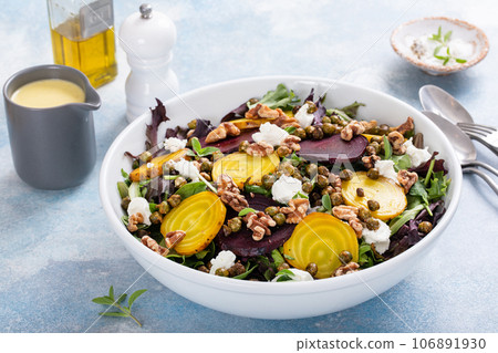 Beet and goat cheese salad with orange dressing 106891930