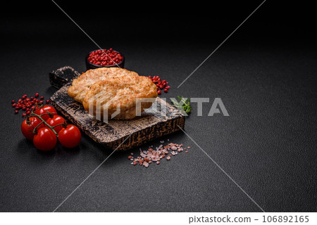 Delicious juicy cutlets or meatballs from minced chicken with salt and spices Delicious juicy cutlets or meatballs from minced chicken with salt and spices 106892165