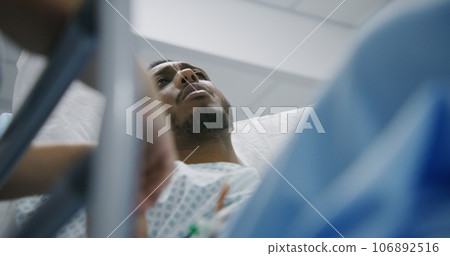 Man lies and talks with doctors before surgery Man lies and talks with doctors before surgery 106892516