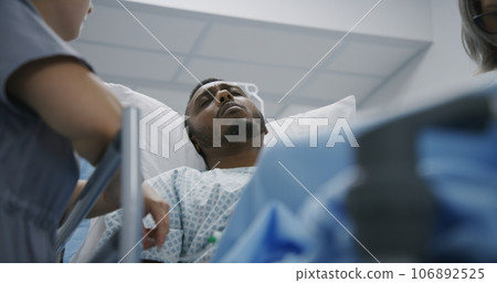 Man lies and talks with doctors before surgery 106892525