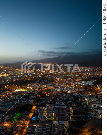 aerial view of illuminated light night city with ocean shore, Tenerife, Canary aerial view of illuminated light night city with ocean shore, Tenerife, Canary 106894088