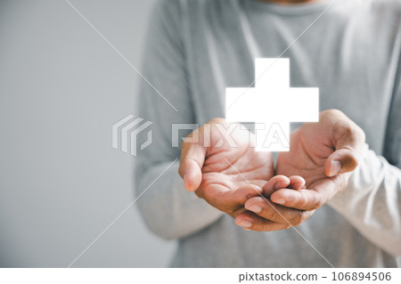 Hand holds plus icon for healthcare, symbolizing benefits. Health insurance health concept, access to welfare health and spacious copy area. Illustrates value addition in medical services. Hand holds plus icon for healthcare, symbolizing benefits. Health insurance health concept, access to welfare health and spacious copy area. Illustrates value addition in medical services. 106894506