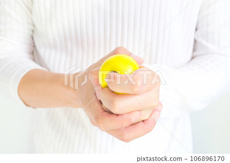 Hands of man with a gentle personality He exhibits stressful behavior from work, and he squeezes the ball expressing emotion, anger, displeasure. Medical concepts and emotional regulation Hands of man with a gentle personality He exhibits stressful behavior from work, and he squeezes the ball expressing emotion, anger, displeasure. Medical concepts and emotional regulation 106896170