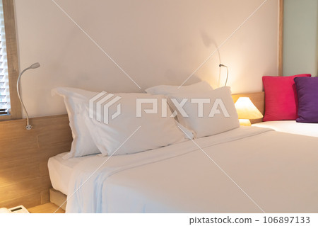 comfortable white pillows on bed 106897133