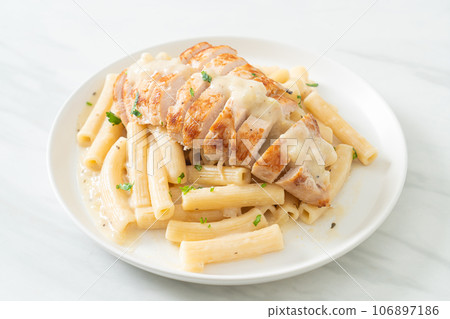quadrotto penne pasta white creamy sauce with grilled chicken 106897186