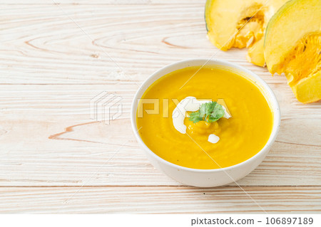 pumpkin soup in white bowl pumpkin soup in white bowl 106897189