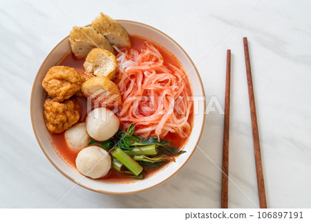 small flat rice noodles with fish balls and shrimp balls in pink soup, Yen Ta Four or Yen Ta Fo small flat rice noodles with fish balls and shrimp balls in pink soup, Yen Ta Four or Yen Ta Fo 106897191
