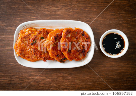 Korean Kimchi pancake or Kimchijeon - Fried Mixed Egg, Kimchi, and Flour Korean Kimchi pancake or Kimchijeon - Fried Mixed Egg, Kimchi, and Flour 106897192