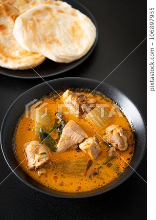 Chicken curry soup with roti Chicken curry soup with roti 106897935