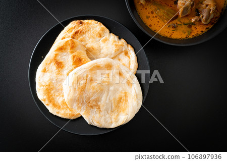 Chicken curry soup with roti Chicken curry soup with roti 106897936