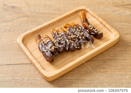 banana chocolate coating or banana dipped chocolate 106897976