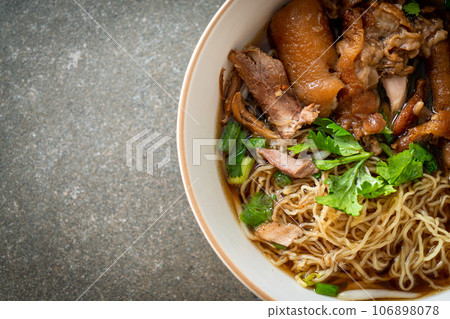 Stewed pork leg noodles in brown soup Stewed pork leg noodles in brown soup 106898078