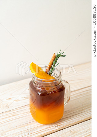 black coffee with orange and lemon juice 106898156