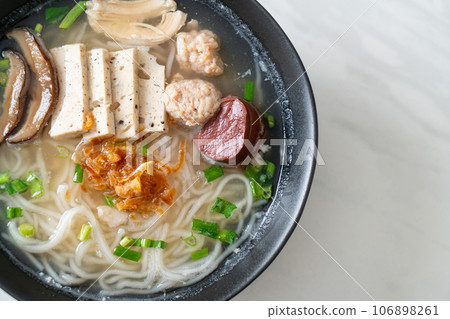 Vietnamese Rice Noodles Soup with Vietnamese Sausage served vegetables and crispy onion Vietnamese Rice Noodles Soup with Vietnamese Sausage served vegetables and crispy onion 106898261