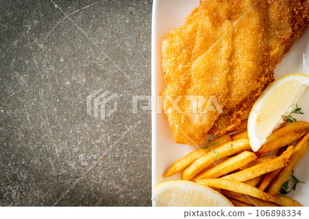 fish and chips - fried fish fillet with potatoes chips 106898334
