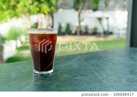 iced americano coffee glass on table iced americano coffee glass on table 106898417