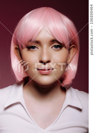 Portrait of a young woman with a pink bob Portrait of a young woman with a pink bob 106898464