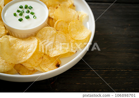 potato chips with sour cream potato chips with sour cream 106898701