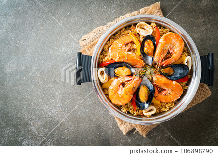 Seafood Paella with prawns, clams, mussels on saffron rice Seafood Paella with prawns, clams, mussels on saffron rice 106898790