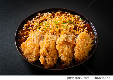Korean instant noodles with fried chicken or Fried chicken ramyeon Korean instant noodles with fried chicken or Fried chicken ramyeon 106898837