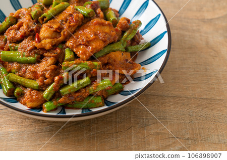 Stir fried pork with red curry paste Stir fried pork with red curry paste 106898907