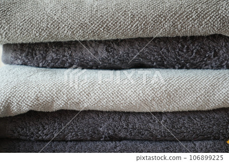 pile of gray and white color shower towel  106899225