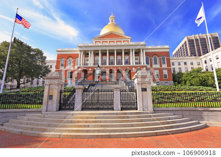 Massachusetts State House and State Library. Imposing red building with white columns and golden dome.  106900918